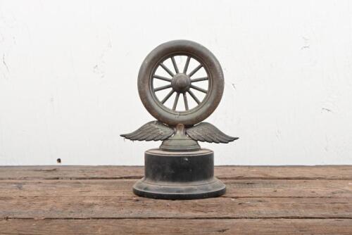 TROPHY: A silverplate winged wheel trophy on Bakelite stand, stamped "Angus and Coote, Sydney" to back, would benefit from a clean