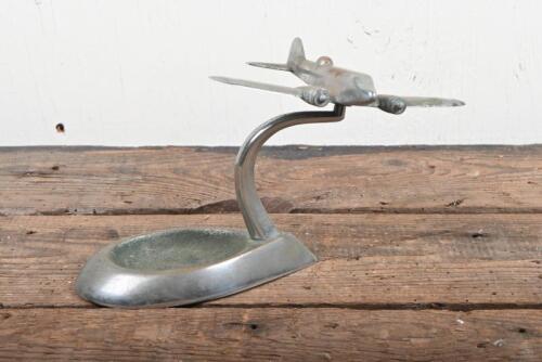 AVIATION: An Art Deco nickel on bronze figure of a aeroplane on ashtray base, 12cm high