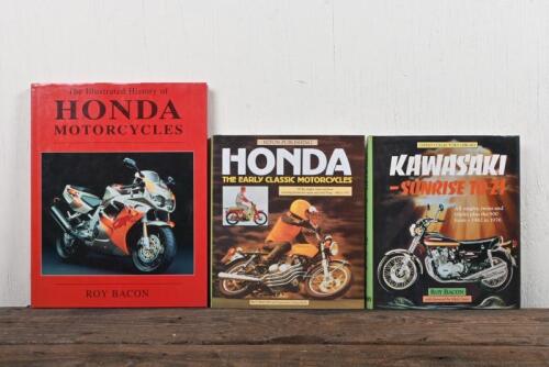 JAPANESE MOTOR CYCLES: A group of three Honda and Kawasaki hardcover books.