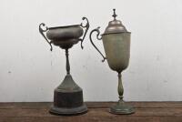 TROPHIES: Two trophies, "The Wakefield Castrol Cup" and the "Inter-Club Challenge TT Trophy", tallest 38cm high, the Wakefield castrol cup lacking an arm and both with slant