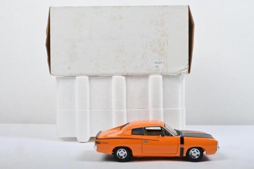 VALIANT: A Trax 1:24 scale 1971 VH Chrysler Valiant Charger (TX 034) in orange