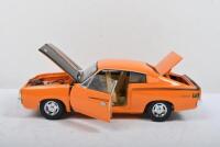 VALIANT: A Trax 1:24 scale 1971 VH Chrysler Valiant Charger (TX 034) in orange - 2