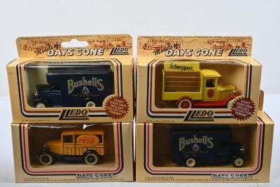 DELIVERY VANS: Four 1:43 scale Lledo 'DAYS GONE' delivery van's in various liveries. Dennis Vans in Bushell's livery, Ford Model 'A' vans in 'Coca-Cola' and 'Schweppes' liveries