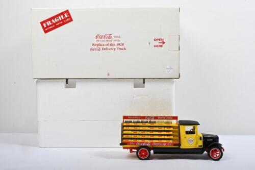 INTERNATIONAL: A The Danbury Mint 1:24 scale replica of the 1928 Coca-Cola Delivery Truck in 'Coca-Cola Bottling Co' livery. Yellow