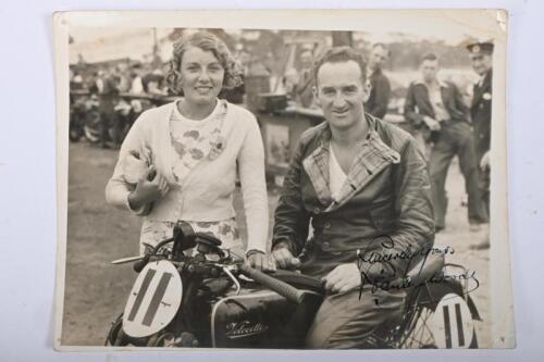 STANLEY WOODS: A hand signed period photograph featuring Staney Woods and his wife possibly after winning the Junior TT on a Velocette, inscribed "Sincerely Yours Staney Woods"