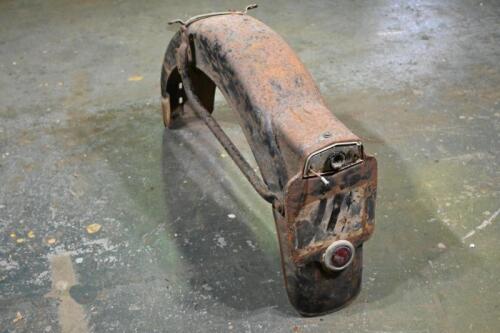 GUARD: A motorcycle rear guard, likely British with numberplate surround