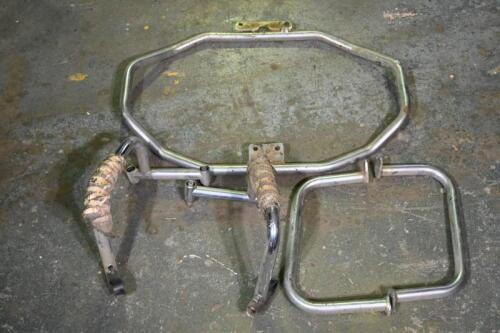 CRASH BARS: A collection of chrome plated tubular metal motorcycle crash bars