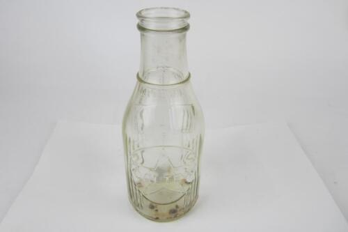 CALTEX: A 'Caltex' New Zealand one imperial pint embossed glass oil bottle.