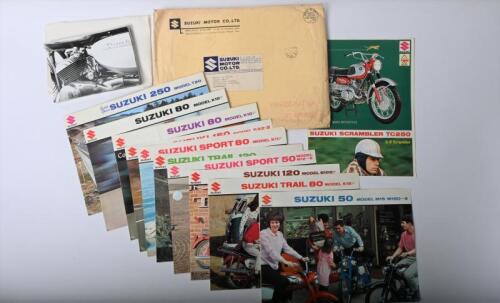 IRVING/SUZUKI: A group of Suzuki related items. 1960's Suzuki model sales brochures & black and white Suzuki 250 MODEL T20 pictures