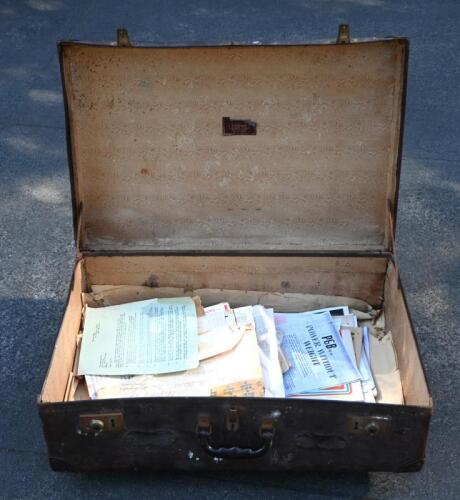 IRVING/SUITCASE: A 'DREWS' of Melbourne brown suitcase. Suitcase with miscellaneous documents