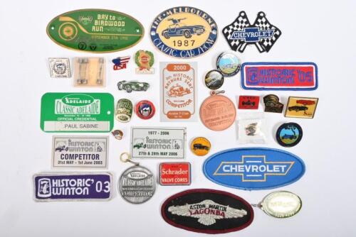 BADGES: One pack of assorted car badges and lapel badges. Four embroidered badges. Four packets of fuses.