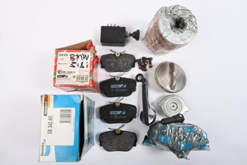 BMW: Bendix brake pads #DB343AD. Lucas brake pads #DB1130. One BMW oil filter #11429063-138. One fuel cap. One radiator cap. One interior window winder