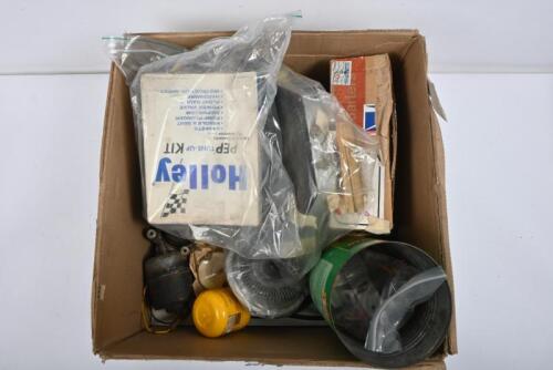 CADILLAC: A selection of parts to suit circa 1957 Cadillac including; One electric window motor. Two wiper motors. Two Holley tune up kits. One brake fluid cap. One oil gauge. One thermostatic coupling. One instrument binnacle with four gauges. One cable 