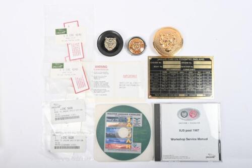 JAGUAR: One NOS unstamped chassis plate. One XJS post 1987 workshop manual disc. One Jaguar master catalogue disc. One set of Jaguar specification labels. Three Jaguar bonnet emblems.