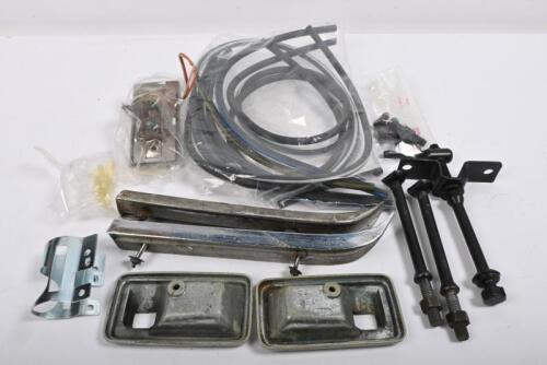 CORVETTE: One black box containing C3 427 bonnet chrome finishers. Interior door handle bits. Spare wheel tie down bolts. One Interior lamp. Steering clamp. Hoses and plastic "T" Pieces.