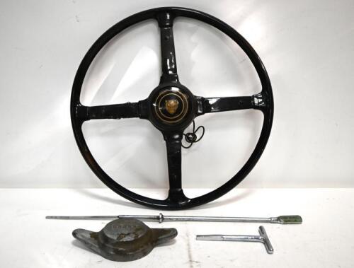JAGUAR: XK140. One XK140 steering wheel with horn button. One engine oil dipstick. One spare wheel cover unlocking tool. One Jaguar left hand wheel spinner. (PHOTOS AND DESCRIPTION UPDATED)