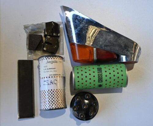 JAGUAR: MARK II. Two oil filters. One set of hand brake pads. One radio blank panel. One right hand tail light assembly. One NOS distributor cap.