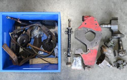 MG: "T-SERIES". One blue box containing steering arms, steering mounts, brake lining, oil pump bodies, oil pump pick up. Washers and springs.