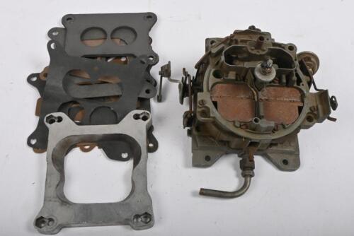 CARBURETTOR: One GM Rochester Quadrajet Carburettor with an assorted bag of carburettor gaskets and one spacer plate.