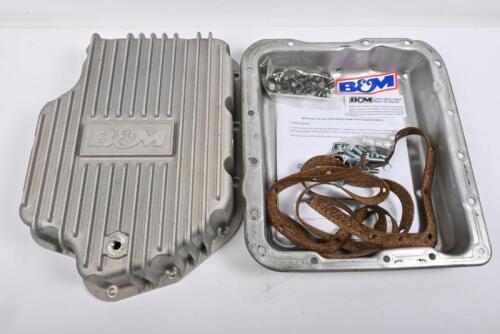 TRANSMISSION: One NOS deep pan auto transmission sump to suit AC4 or C6 auto. One steel pan to suit a Turbo 400 Automatic.