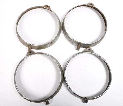 HEADLAMP RIMS: Four older style 7 1/4 inch headlight rims to suit British Cars.