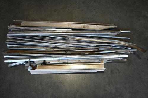BODY TRIM PIECES: One box of approximately 40 BODY trim pieces from 60's and 70s cars.