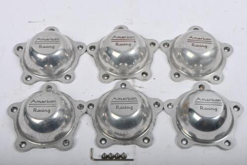 AMERICAN RACING: Six aluminium "American Racing" centre wheel caps.