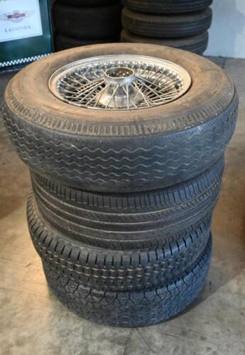 WHEELS: One set of four used 15 inch chrome wire wheels to suit Aston Martin DBS or Jaguar.