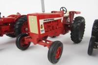 &nbsp;TRACTOR MODELS: Three&nbsp;scale die-cast tractor models of various manufacturers including Farmall,&nbsp;McCormick, Massey-Ferguson - 3