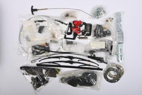 PORSCHE: 911. One black plastic box containing wiper arms and blades. Brake and clutch pedal rubber. Petrol cap door cable. Number plate bracket. Seat belt parts. Boot lid letters. Door hinges. Luggage compartment brackets. An engine cover release cable.
