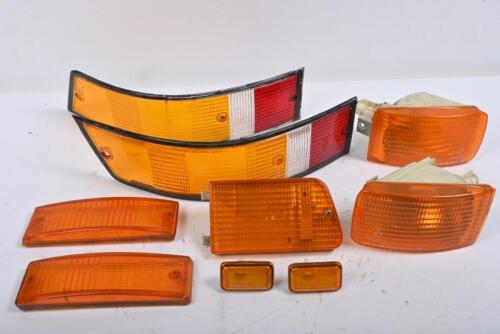 PORSCHE: 911. One pair early 911 tail light lenses. Seven amber indicator lens.