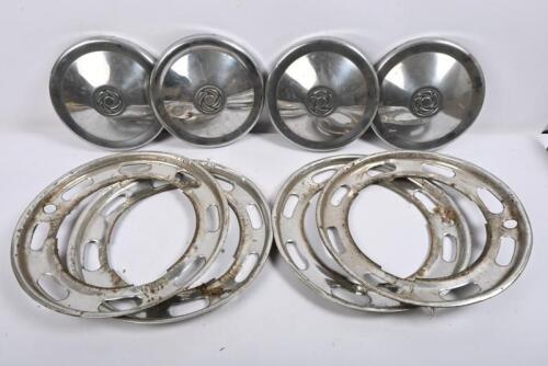 TRIUMPH: 2000. One set of four hubcaps. One set of four slotted wheel trims