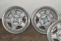 ALFA ROMEO: A set of five Simmons B-45 15 x 7.5 alloy racing wheels with Alfa Romeo livery grease cap, removed from a Montreal. Can be used on a wide range of cars - 3