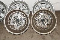 ALFA ROMEO: A set of five Simmons B-45 15 x 7.5 alloy racing wheels with Alfa Romeo livery grease cap, removed from a Montreal. Can be used on a wide range of cars - 10