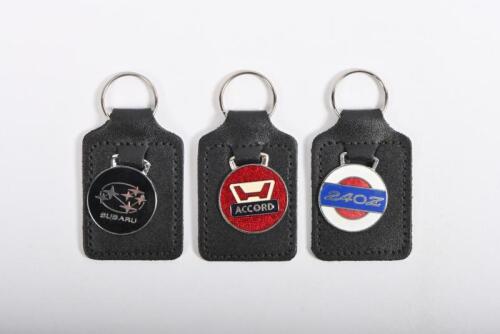 KEYRINGS: Three keyrings for Japanese marques and models including Honda Accord, Subaru and Datsun 240z
