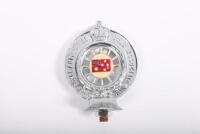 RACV: A Royal Automobile Club of Victoria front bumper members badge,&nbsp;Australian Red Ensign centered on one side, RACV logo on reverse side. '4580' engraved to base along with 'Property of the RACV' engraved to Australian Red Ensign side base - 2