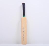 ALLAN BORDER: A mini wooden cricket bat, autographed by Allan Border