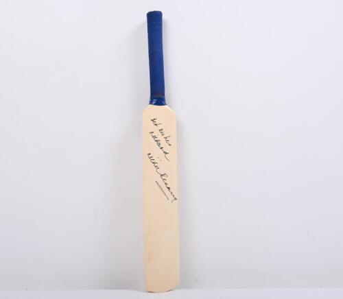 RICHIE BENAUD: A mini wooden cricket bat personally inscribed and signed by Richie Benaud