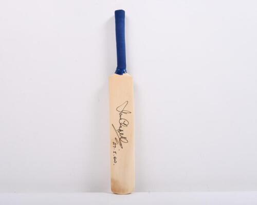 IAN CHAPPELL: A mini wooden cricket bat, autographed by Ian Chappell