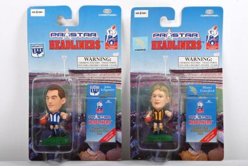 HEADLINERS FIGURINES: Two AFL 'Prostar Headliners' figurines, John Longmire and Shane Crawford, in original packages&nbsp;