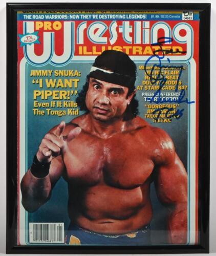 JIMMY SNUKA: A framed and glazed printed Pro Wrestling Illustrated magazine cover, autographed by Jimmy Snuka