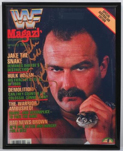 JAKE ROBERTS: A framed and glazed printed WWF magazine cover autographed by Jake 'The Snake' Roberts