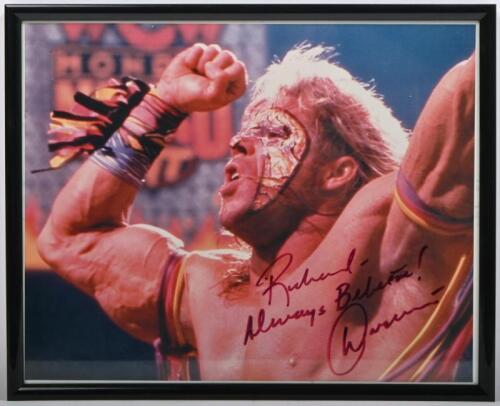 ULTIMATE WARRIOR: A framed and glazed colour picture of the 'Ultimate Warrior', signed by James Brian Hellwig