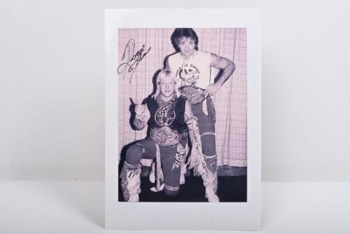 ROCK N ROLL EXPRESS: A black and white picture of the 'Rock N Roll Express' depicting tag team wrestlers Robert Gibson & Ricky Morton, autographed by Robert Gibson and Ricky Morton