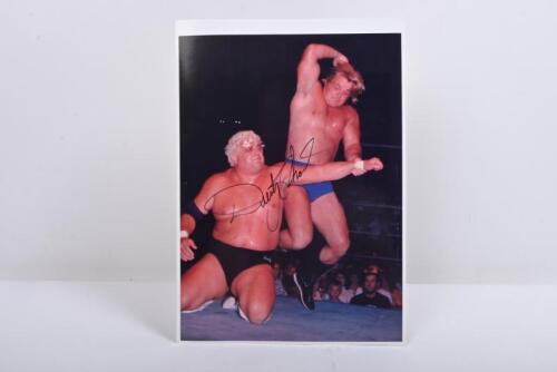 DUSTY RHODES: A colour image depicting Dusty in fight action, autographed by Dusty Rhodes