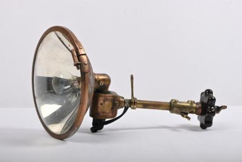 PILLAR LAMP: A 1920s Thomson adjustable pillar mounted brass spotlight