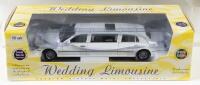 WEDDING LIMOUSINE: A NOS 1:18 scale Sunstar Stretch Limo Lincoln Town Car Wedding Limousine die-cast metal model with opening parts