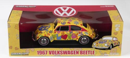 VOLKSWAGEN: A NOS 1:18 scale Greenlight Volkswagen 1967 Beetle die-cast model with opening parts