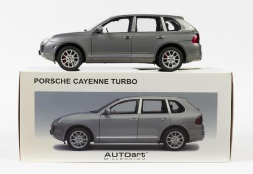 PORSCHE: A NOS 1:18 scale AutoArt Porsche Cayenne Turbo Grey Metallic die-cast model with opening parts