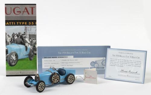 BUGATTI: A NOS 1:24 scale Franklin Mint Precision Models Bugatti 1924 Type 35 die-cast model with steerable front wheels, opening hood and Certificate of Authenticity